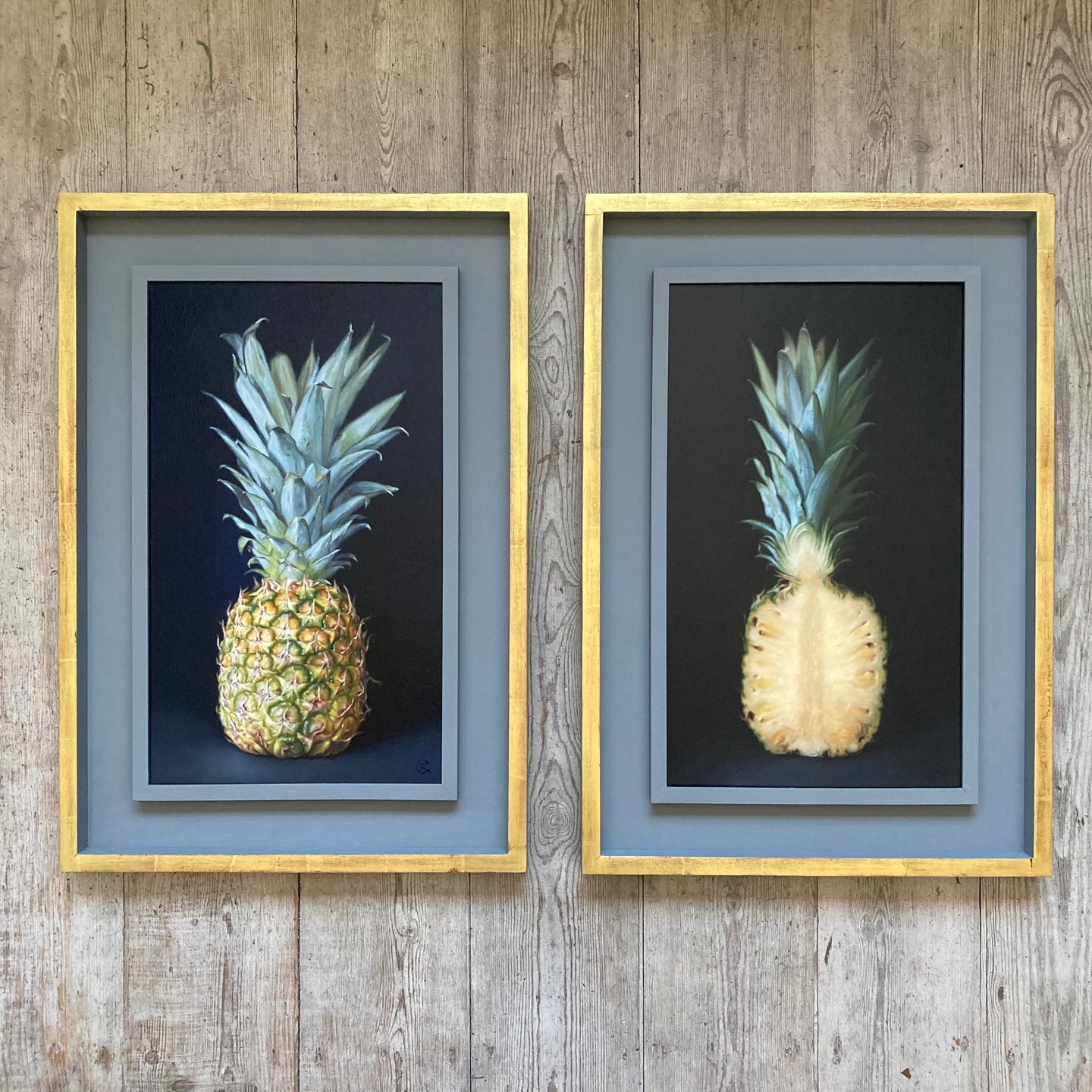 A pair of bespoke frames made for artist @carolinerichardsonartist. Painted in Farrow & Ball Plummett with 22ct gold leaf over a red clay on the outside.